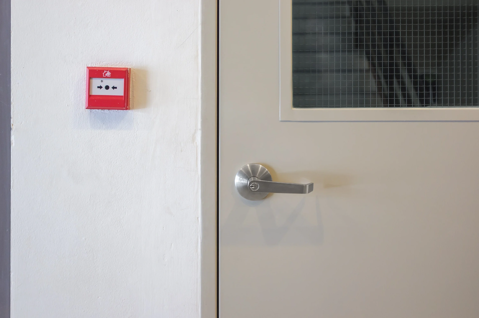 Modern commercial fire-rated door with a glass viewing panel — Headlands Glass in Ballina, NSW
